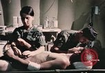 Image of wounded United States soldier Vietnam, 1969, second 47 stock footage video 65675022607