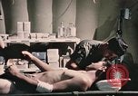 Image of wounded United States soldier Vietnam, 1969, second 52 stock footage video 65675022607