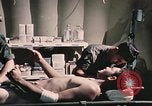 Image of wounded United States soldier Vietnam, 1969, second 62 stock footage video 65675022607