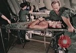 Image of wounded United States soldier Vietnam, 1969, second 7 stock footage video 65675022608