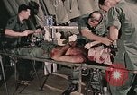 Image of wounded United States soldier Vietnam, 1969, second 13 stock footage video 65675022608