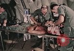 Image of wounded United States soldier Vietnam, 1969, second 15 stock footage video 65675022608