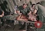 Image of wounded United States soldier Vietnam, 1969, second 18 stock footage video 65675022608