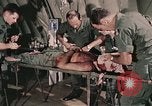 Image of wounded United States soldier Vietnam, 1969, second 21 stock footage video 65675022608