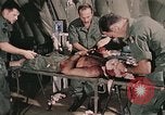 Image of wounded United States soldier Vietnam, 1969, second 25 stock footage video 65675022608
