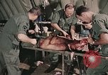 Image of wounded United States soldier Vietnam, 1969, second 29 stock footage video 65675022608