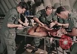 Image of wounded United States soldier Vietnam, 1969, second 32 stock footage video 65675022608