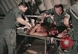Image of wounded United States soldier Vietnam, 1969, second 36 stock footage video 65675022608