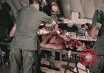 Image of wounded United States soldier Vietnam, 1969, second 46 stock footage video 65675022608