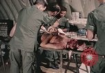 Image of wounded United States soldier Vietnam, 1969, second 48 stock footage video 65675022608