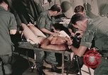 Image of wounded United States soldier Vietnam, 1969, second 52 stock footage video 65675022608