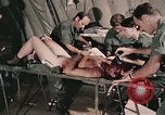 Image of wounded United States soldier Vietnam, 1969, second 53 stock footage video 65675022608