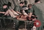 Image of wounded United States soldier Vietnam, 1969, second 54 stock footage video 65675022608