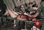 Image of wounded United States soldier Vietnam, 1969, second 56 stock footage video 65675022608