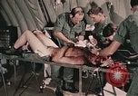 Image of wounded United States soldier Vietnam, 1969, second 57 stock footage video 65675022608