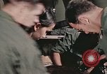 Image of wounded United States soldier Vietnam, 1969, second 58 stock footage video 65675022608