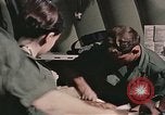 Image of wounded United States soldier Vietnam, 1969, second 60 stock footage video 65675022608
