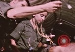 Image of wounded United States soldier Vietnam, 1969, second 37 stock footage video 65675022609