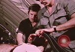 Image of wounded United States soldier Vietnam, 1969, second 51 stock footage video 65675022609