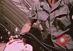 Image of wounded United States soldier Vietnam, 1969, second 54 stock footage video 65675022609
