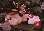 Image of wounded United States soldier Vietnam, 1969, second 57 stock footage video 65675022609