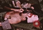 Image of wounded United States soldier Vietnam, 1969, second 58 stock footage video 65675022609