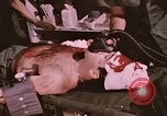 Image of wounded United States soldier Vietnam, 1969, second 59 stock footage video 65675022609