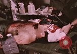 Image of wounded United States soldier Vietnam, 1969, second 61 stock footage video 65675022609