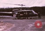 Image of operation on wounded soldier Vietnam, 1969, second 3 stock footage video 65675022610