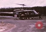 Image of operation on wounded soldier Vietnam, 1969, second 4 stock footage video 65675022610