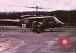 Image of operation on wounded soldier Vietnam, 1969, second 7 stock footage video 65675022610