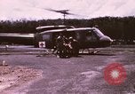Image of operation on wounded soldier Vietnam, 1969, second 9 stock footage video 65675022610