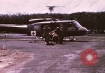 Image of operation on wounded soldier Vietnam, 1969, second 10 stock footage video 65675022610