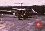 Image of operation on wounded soldier Vietnam, 1969, second 11 stock footage video 65675022610