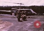 Image of operation on wounded soldier Vietnam, 1969, second 12 stock footage video 65675022610