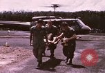 Image of operation on wounded soldier Vietnam, 1969, second 15 stock footage video 65675022610