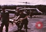Image of operation on wounded soldier Vietnam, 1969, second 16 stock footage video 65675022610