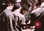 Image of operation on wounded soldier Vietnam, 1969, second 44 stock footage video 65675022610