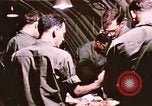 Image of operation on wounded soldier Vietnam, 1969, second 45 stock footage video 65675022610