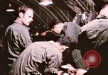 Image of operation on wounded soldier Vietnam, 1969, second 49 stock footage video 65675022610