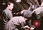 Image of operation on wounded soldier Vietnam, 1969, second 50 stock footage video 65675022610