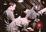 Image of operation on wounded soldier Vietnam, 1969, second 54 stock footage video 65675022610