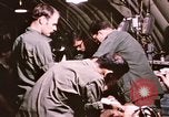Image of operation on wounded soldier Vietnam, 1969, second 55 stock footage video 65675022610
