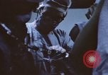 Image of wounded United States soldier Vietnam, 1969, second 43 stock footage video 65675022611