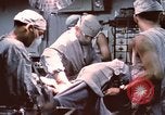 Image of wounded United States soldier Vietnam, 1969, second 52 stock footage video 65675022612