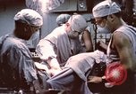 Image of wounded United States soldier Vietnam, 1969, second 58 stock footage video 65675022612