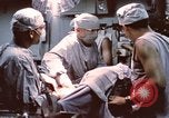 Image of wounded United States soldier Vietnam, 1969, second 62 stock footage video 65675022612