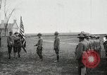 Image of US Army troops and band marching with flag during training United States USA, 1916, second 6 stock footage video 65675022632