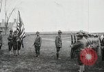 Image of US Army troops and band marching with flag during training United States USA, 1916, second 16 stock footage video 65675022632