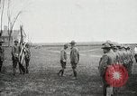 Image of US Army troops and band marching with flag during training United States USA, 1916, second 18 stock footage video 65675022632